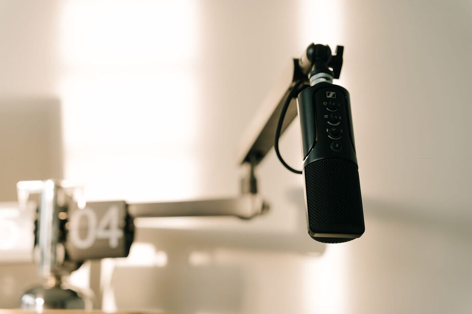 Professional podcast production microphone on a studio boom arm