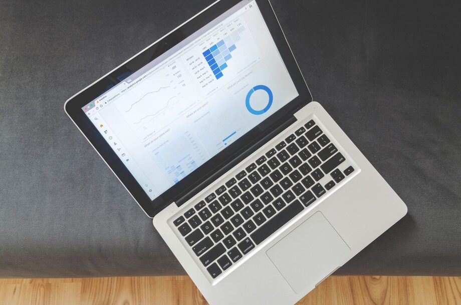 SEO analytics dashboard on a laptop showing search traffic and ranking trends