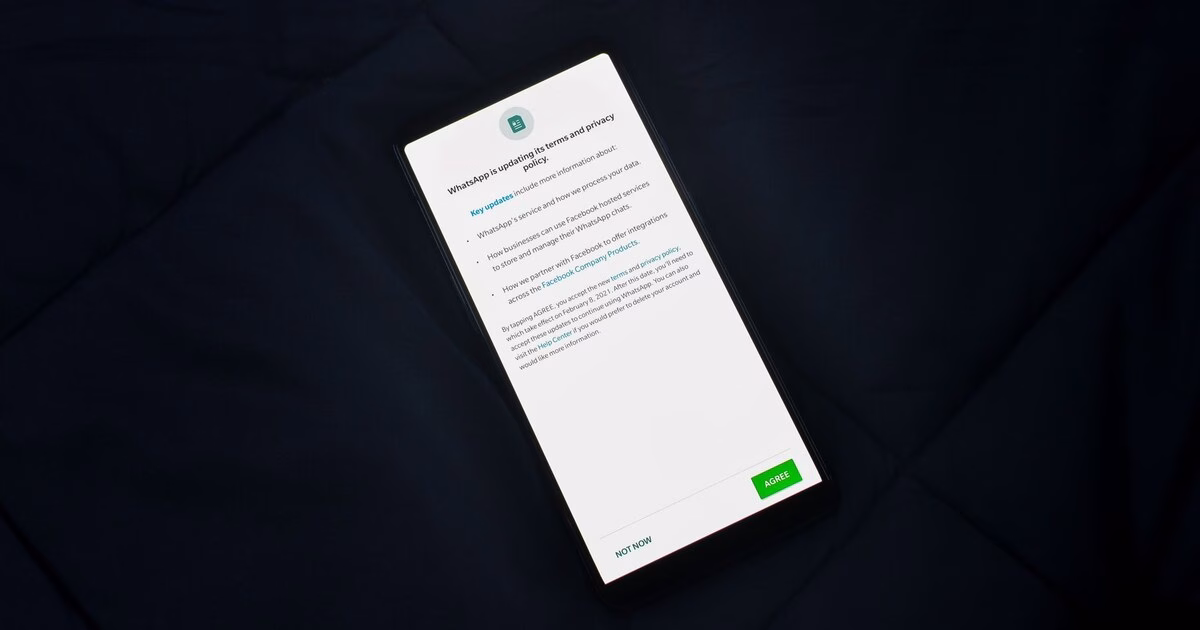 Smartphone showing a privacy policy consent notice with Agree and Not Now buttons