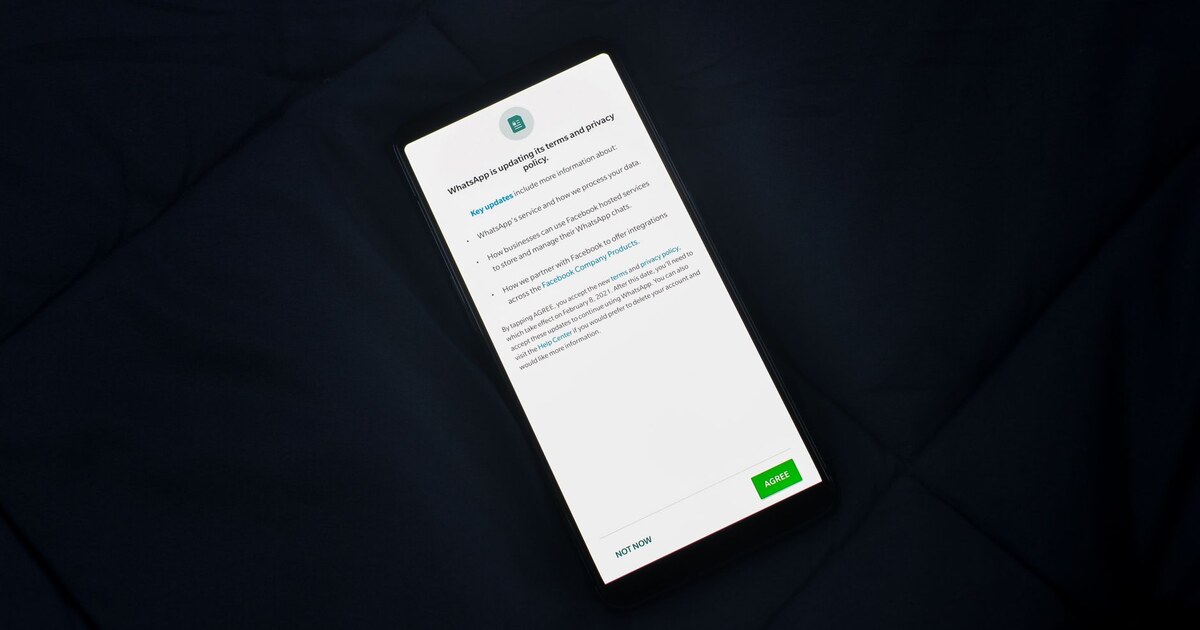 Smartphone showing a privacy policy consent notice with Agree and Not Now buttons